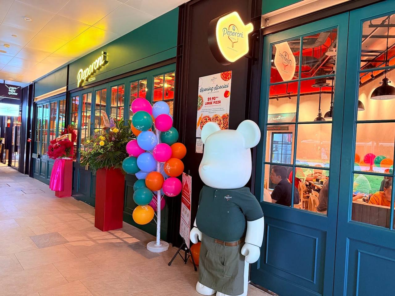 Peperoni Pizzeria at Paya Lebar Quarter, with outdoor tables where leashed dogs are welcome.