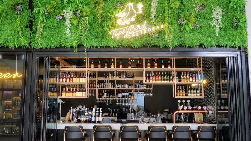 The Tipsy Bird on the open-air promenade at Paya Lebar Quarter. Leashed dogs are welcome at the outdoor tables.